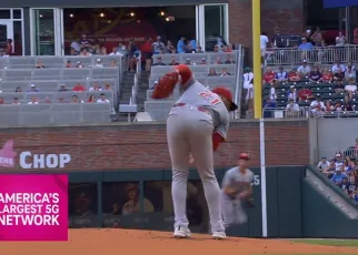 Reds' Hunter Greene makes a slick behind-the-back grab and throws out the runner against the Braves