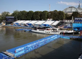 Olympic triathletes begin swim in Seine River after water concerns