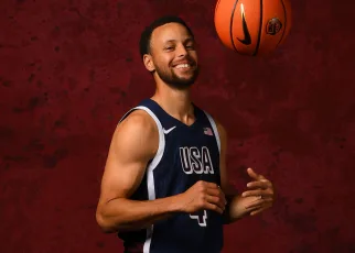 Steph happily exchanges pins with other Team USA athletes in Paris