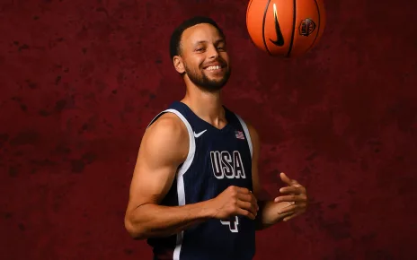 Steph happily exchanges pins with other Team USA athletes in Paris