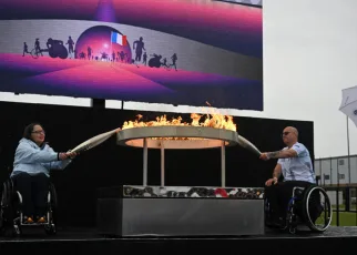 Paris Paralympics flame is lit before journey from English village, under sea and over land