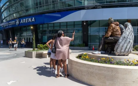 Kobe Bryant and Gianna are sitting near Crypto.com Arena entrance named after Lakers icon