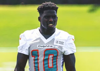 Dolphins’ Tyreek Hill agrees to three-year,  million restructured deal