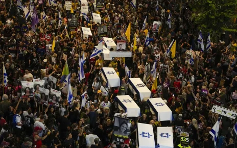 Protesters march in Tel Aviv with makeshift coffins to demand release of Gaza hostages