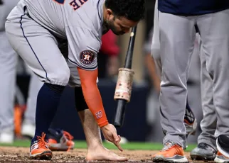 Jose Altuve tossed for removing cleat, sock in wild Astros win