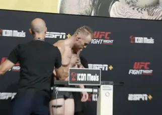 Wobbly UFC fighter nearly collapses during botched weigh in, carried off stage in scary scene (Video)