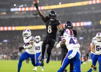 Ravens crush Bills to cap wild NFL weekend; inside Georgia vs. Alabama; MLB playoff field nearly complete