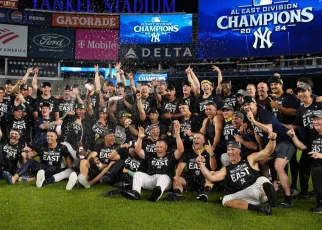 Yankees and Dodgers clinch division titles; Cowboys beat Giants but lose key players