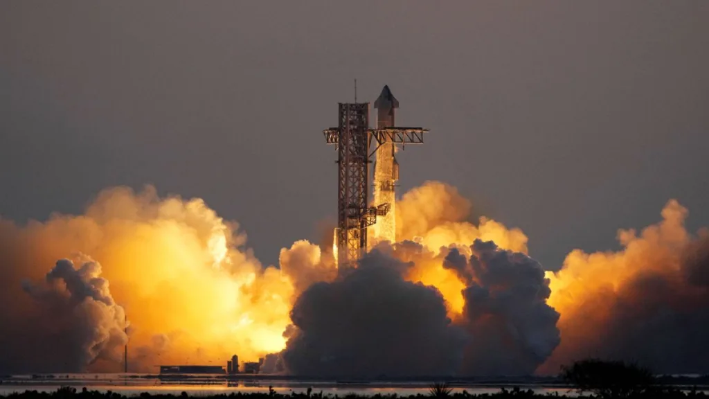 SpaceX catches Starship rocket booster as it returns to Earth