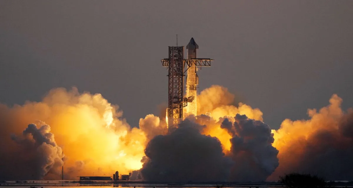 SpaceX catches Starship rocket booster as it returns to Earth