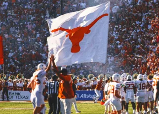 Texas players plant flag through Baker Mayfield Oklahoma jersey following win