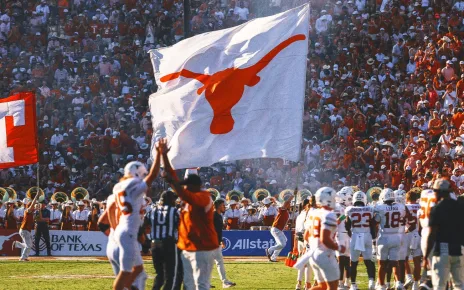 Texas players plant flag through Baker Mayfield Oklahoma jersey following win